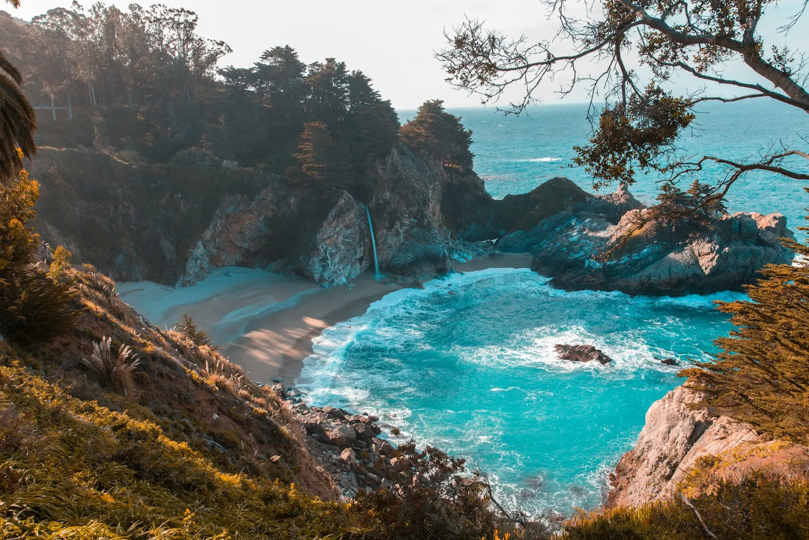 Sunlit coast with turquoise water, ready for your next escape